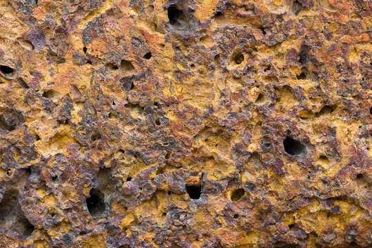 Porous Spongy Yellow Brown Background With Holes