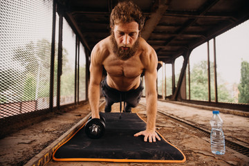 Man working out at old train station
