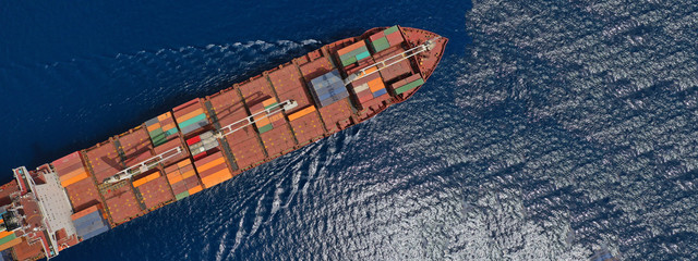 Aerial drone panoramic ultra wide photo of industrial container tanker ship cruising in open ocean...