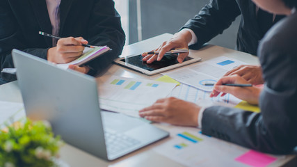 Business people are analyzing and planning business. Business Strategy Consulting