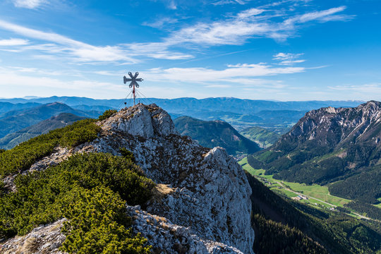 The summit cross of the "Leobner Mauer" mountain on a beautiful day, "Hochschwab" mountain range