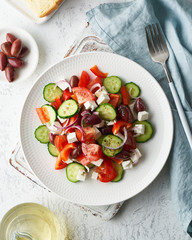 Greek village salad horiatiki with feta cheese, olives, cherry tomato, cucumber and red onion