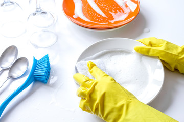 concept of woman washing dishes on white background
