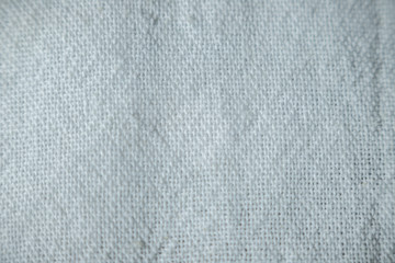 Fototapeta na wymiar Close-up cloth of a kitchen white cotton towel. Details textile, fabric, selective focus, copy space