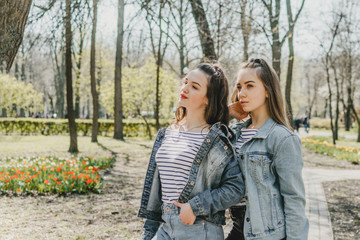 Generation Z, gen z, Homelanders, Homeland Generation, Zoomers, New Silent Generation. Two young Happy girls friends having fun in the summer park