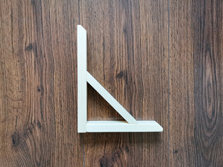 Wooden bracket for mounting on a vertical plane furniture shelves or adjustable systems. An aspen array coated with clear varnish.