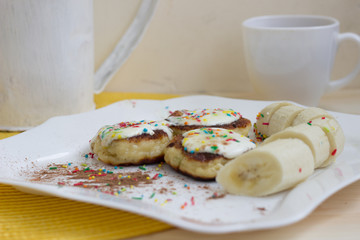 Breakfast at a wooden table yellow flowers on a white background