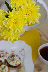 Breakfast at a wooden table yellow flowers on a white background