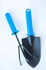 Gardening at home. Growing food on windowsill. Tools, peat pots for seedlings. frame for text, top view. Flatlay on white wooden background
