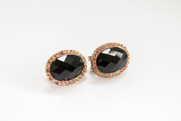 gold earrings with black stone