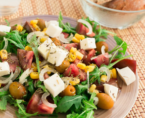 fresh vegetarian healthy vegetable salad with arugula and chees