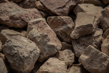 Cobblestones outdoors texture. Broken fireplaces in the street.Concrete road broken in. It is not standard
