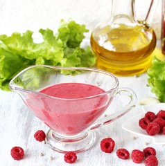berry sauce with raspberries. salad  berry vinaigrette dressing. 
copy space