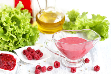 Fototapeta na wymiar berry sauce with raspberries. salad berry vinaigrette dressing. copy space