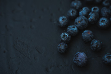 blueberries on a black background