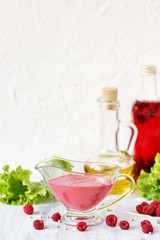 berry sauce with raspberries. salad  berry vinaigrette dressing. 
copy space