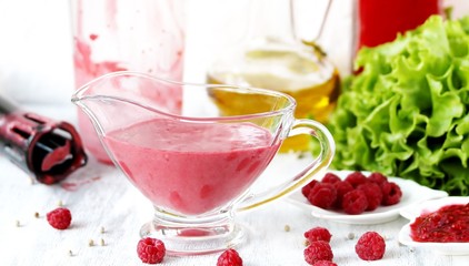 berry sauce with raspberries. salad  berry vinaigrette dressing. 
copy space
