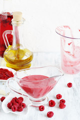 berry sauce with raspberries. salad  berry vinaigrette dressing. 
copy space