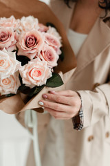 Obraz na płótnie Canvas Bouquet of pink roses. The roses are artificial. Bouquet of artificial flowers. Flowers as a gift. Decorative flowers. 