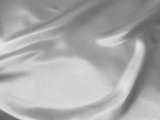 Silver shiny fabric with fluid waves