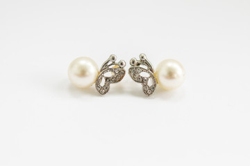 earrings with pearls on a white background