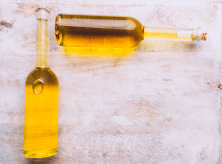 Various oil glass bottles on wooden background
