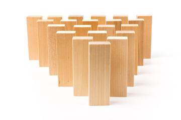 Domino effect, row of wood domino on white background