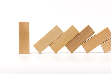 Row of wooden block tower game children isolated on white background