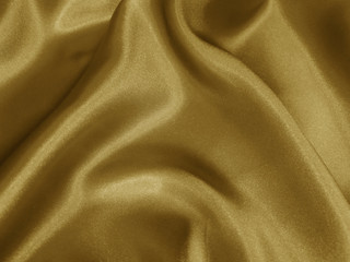 Shiny gold crumpled fabric background.