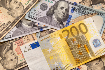 Money and finances concept. Two hundred euro new bill on colorful abstract background of American...