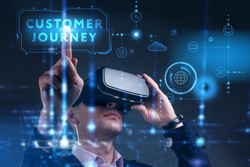 Business, Technology, Internet and network concept. Young businessman working on a virtual screen of the future and sees the inscription: Customer journey