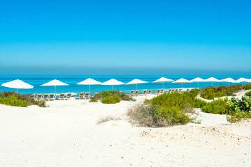 Beautiful landscape of clear turquoise ocean and sandy beach in Saadiyat island