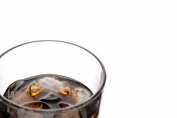 Cola glass with ice cubes on a white background