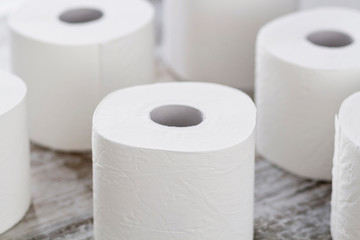 A group of toilet paper rolls in different shapes