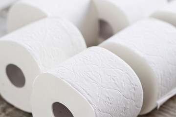 A group of toilet paper rolls in different shapes