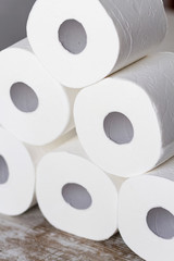 A group of toilet paper rolls in different shapes