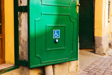 Button on door to call for help to people with disabilities