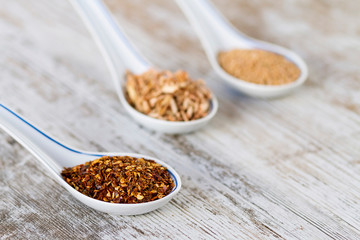 Spices and herbs in porcelain spoons