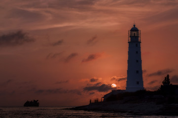 Pink sunset at the lighthouse at cape Tarkhankut, Crimea
