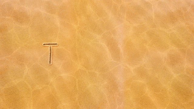 Handwritten animated live text on the sand-Tuesday.