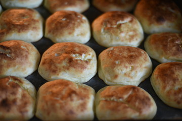 Rosy and cracked buns have just been taken out of the oven. Delicious!