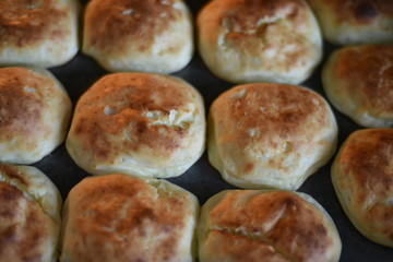 Rosy and cracked buns have just been taken out of the oven. Delicious!