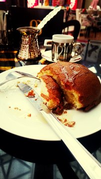 Close-up Of Half Eaten Bread On Table