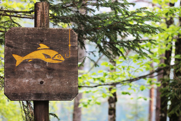 sign near the lake fishing spot