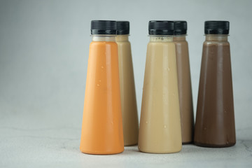Various refreshing coffee and milk tea drinks in plastic bottle