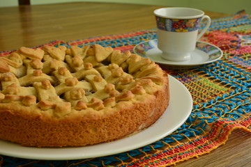 banana pie with coffee on the table