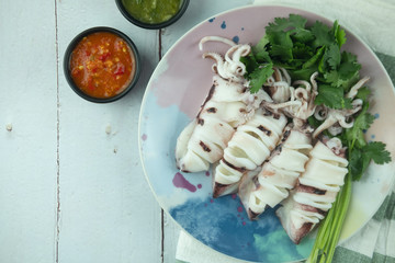 Steamed Squids or Octopus served with spicy seafood sauce chili.