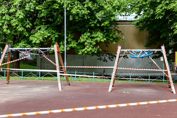 Obraz na płótnie Canvas Moscow Russia: Closed children's playground as a measure to prevent spread of coronavirus COVID-19. No children on the Playground in the yard.