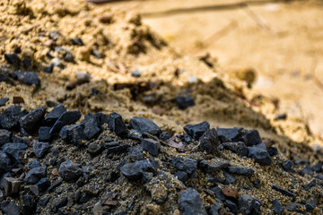 Close up stone pile ground at a construction site during break time of house maintenance in a sunny summer day