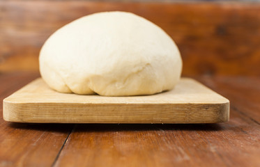 flour and dough on the board